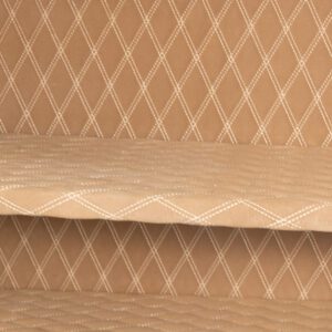 Detail view of the AMSEC AM3020Plus safe’s empty interior, highlighting the tan quilted fabric with white diamond stitching.