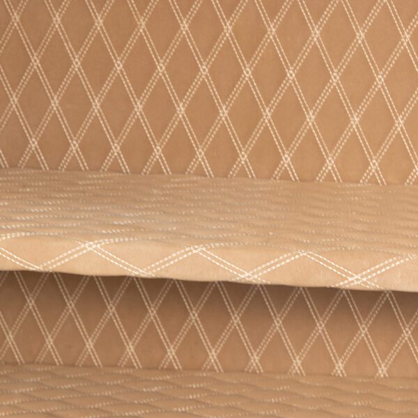 Detail view of the AMSEC AM3020Plus safe’s empty interior, highlighting the tan quilted fabric with white diamond stitching.